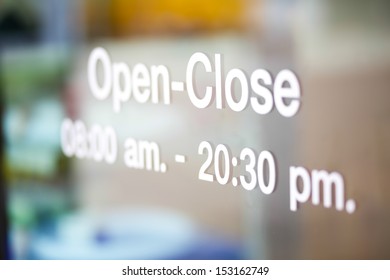 Open And Closed Sign On Glass Door