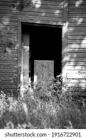 Open Closet Door In Wooden Barn Wall