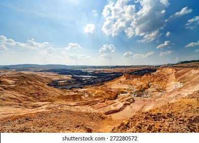 Open Coal Mining Pit With Heavy Machinery