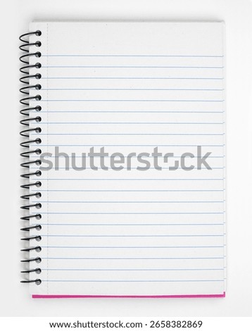 Open coil notebook with blank lined paper page over a white background. Copy space.