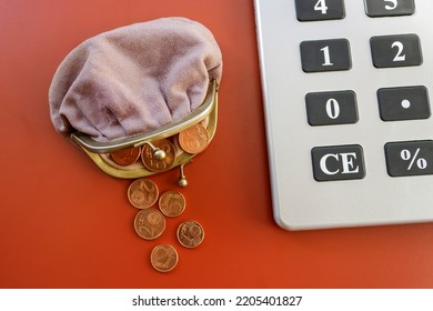 Open Coin Purse With Euro Cent Coins Beside Big Calculator