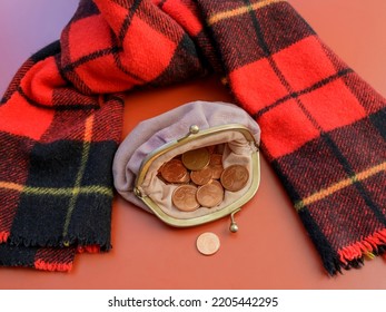 Open Coin Purse With Euro Cent Coins Beside Winter Scarf