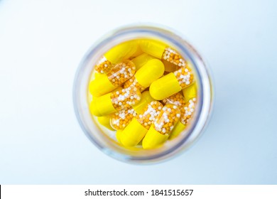 Open Container With Vitamin D3 And K2 Capsules Isolated On White Background