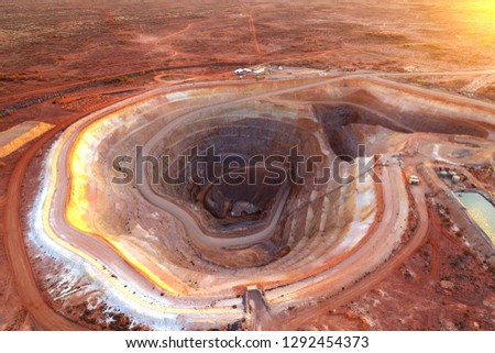 Open cut gold mining operation in remote Australia showing pit and spoil piles