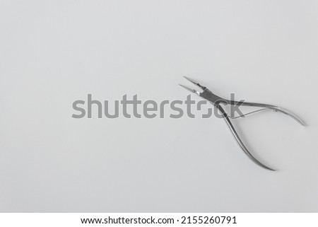 Open dental forceps for removing the root of the tooth isolated on the white background. Orthodontic surgery for humans and animals. Dental care and vet medicine concept.