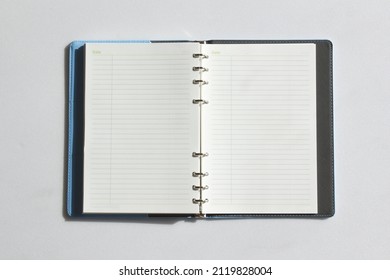 Open diary, planner or notebook. Office and business supplies for lists, reminders, schedules or agendas.