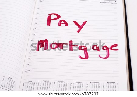 An open diary with a reminder to pay the mortgage