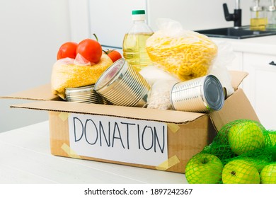 Open Donation Box With Food In Kitchen. Help For People. Charity Concept