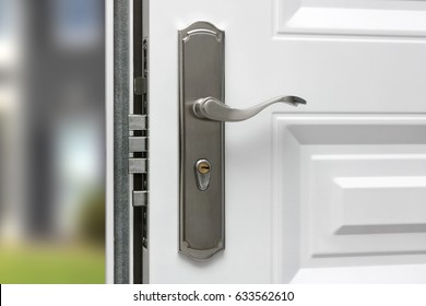 Open Door Of A Family Home. Close-up Of The Lock Of An Armored Door.