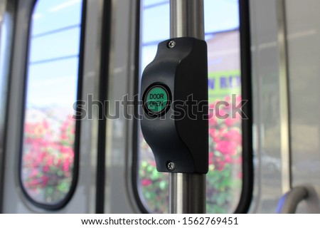 Open the door. Green button for opening doors in the subway and bus. Button to stop transport. Button to stop the bus.