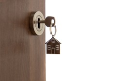 Open Door To A New Home. Key And Home Shaped Keychain, Isolated. Mortgage, Investment, Real Estate, Property And New Home Concept