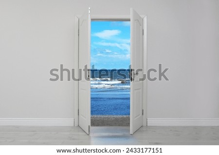 Open door in white wall inviting to visit beach