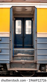 Open doors to the yellow and blue old train