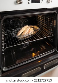 Open Electric Oven With Hot Air Ventilation. New Oven. Door Is Open And Light Is On. Vertical