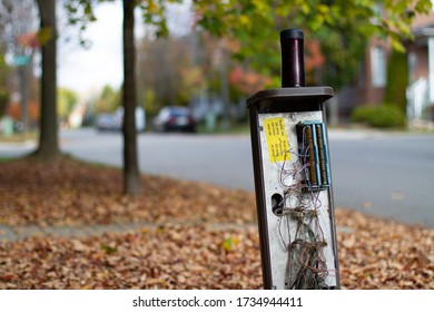 Open Electrical Box In Front Of Houses