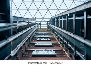 Open Elevator Lift Shaft. Modern Architecture With Transparent Ceiling. Shopping Mall Or Business Center. Maintenance Repair And Service