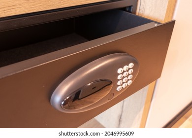 Open Empty Black Safe In Hotel Room Or Home. Safety Box Drawer With Modern Electronic Locker And Buttons