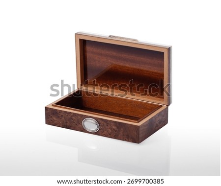 open and empty briar box, on a white background with reflection