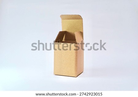 Open empty brown cardboard box with top flaps unfolded, isolated on white background. Concept of packaging, shipping, storage, moving, ecommerce, and product mockup template.                               