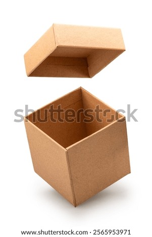 Open empty brown gift box and lid floating above a box isolated on white background. File contains clipping path.