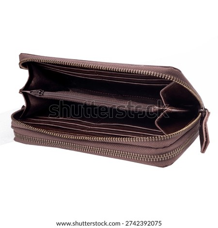 Open and empty brown leather wallet isolated on white background