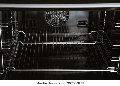 Open Empty Electric Oven With Rack, Closeup. Inside View