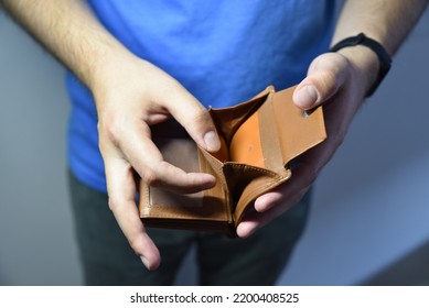 An Open Empty Purse Without Money In It