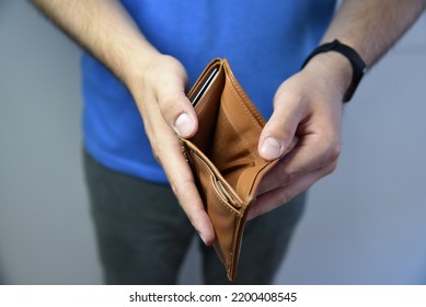 An Open Empty Purse Without Money In It