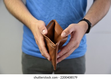 An Open Empty Purse Without Money In It