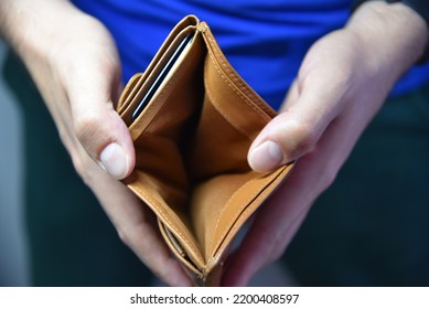 An Open Empty Purse Without Money In It