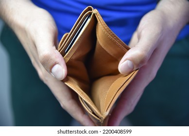 An Open Empty Purse Without Money In It