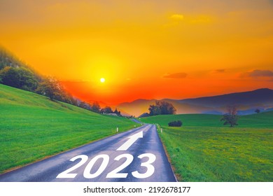 Open empty road path end and new year 2023. Upcoming 2023 goals and leaving behind 2022 year. passing time future, life plan change, work start run line, sunset hope growth begin, go forward concept.