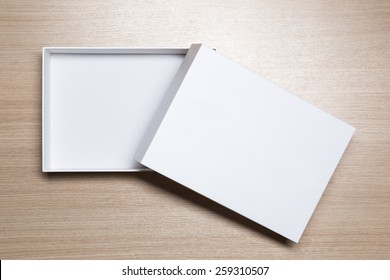 Open Empty White Box On Wooden Table