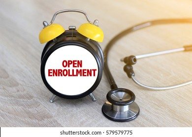 Open Enrollment concept. Stethoscope and watch