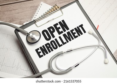 Open Enrollment Sign On Notebook With Stethoscope And Cardio Charts