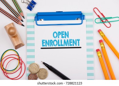 Open Enrollment. White Office Desk With Stationery