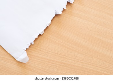 Open Envelope On Wooden Table.