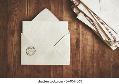 Open Envelope On A Wooden Table