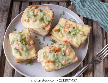 Open Face Grilled Ham And Cheese Sandwich With Bell Peppers And Chives On French Baguette