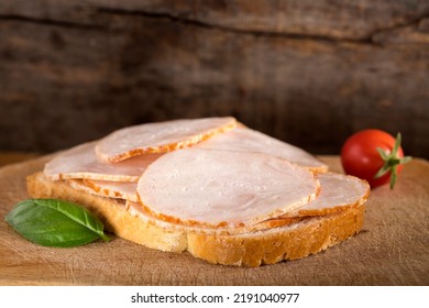 Open Faced Chicken Ham Sandwich Over Wooden Background