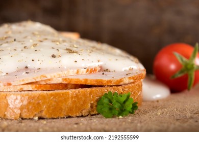 Open Faced Chicken Ham Sandwich With Garlic Sauce Over Wooden Background