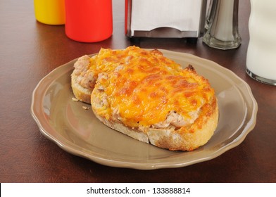 An Open Faced Tuna Melt Sandwich In A Cafe