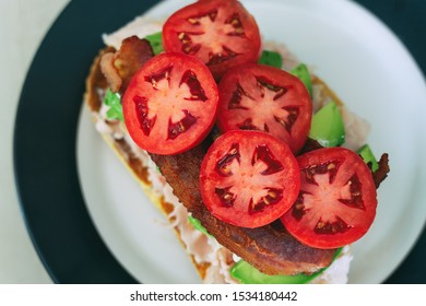 Open Faced Turkey Club Sandwich On Fresh Sourdough With Avocado And Bacon. 