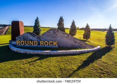 Open Field With Welcome Sign To Round Rock , Texas 