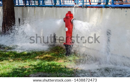 Open fire hydrant, water flows from a fire hydrant