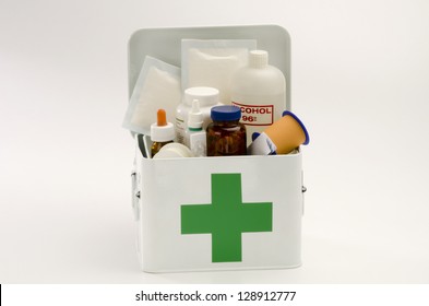 Open First Aid Kit Filled With Medical Supplies In White Background