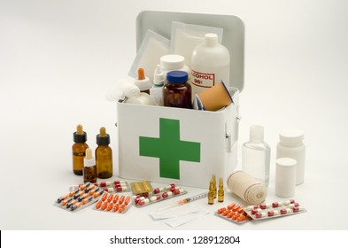 Open First Aid Kit Filled With Medical Supplies In White Background