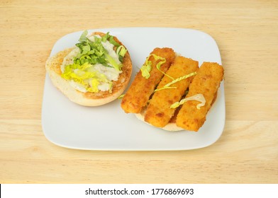 Open Fish Finger Roll On A Plate On A Wooden Tabletop