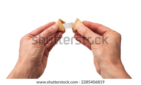 open the fortune cookie and find the leaflet. isolated white background