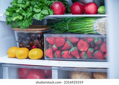 Open fridge full of fresh fruits and vegetables, vegetarian food healthy food background, greenery, organic nutrition, health care, dieting concept. - Powered by Shutterstock